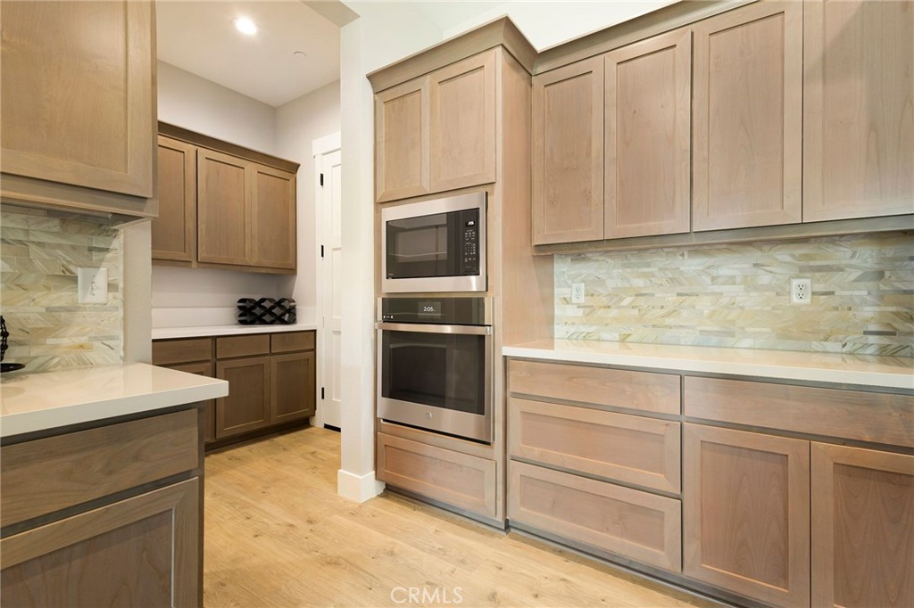 3 Haystack Court Chico, CA 95973 - Photo 23 of 75 a kitchen with granite countertop white cabinets and stainless steel appliances