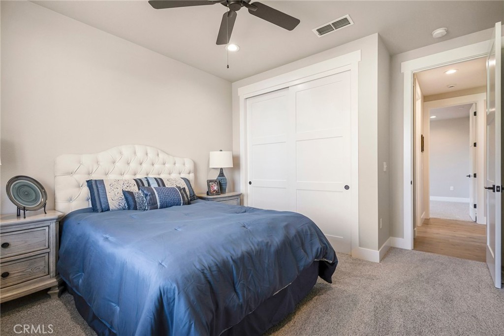 3 Haystack Court Chico, CA 95973 - Photo 39 of 75 a bedroom with a large bed and a chandelier