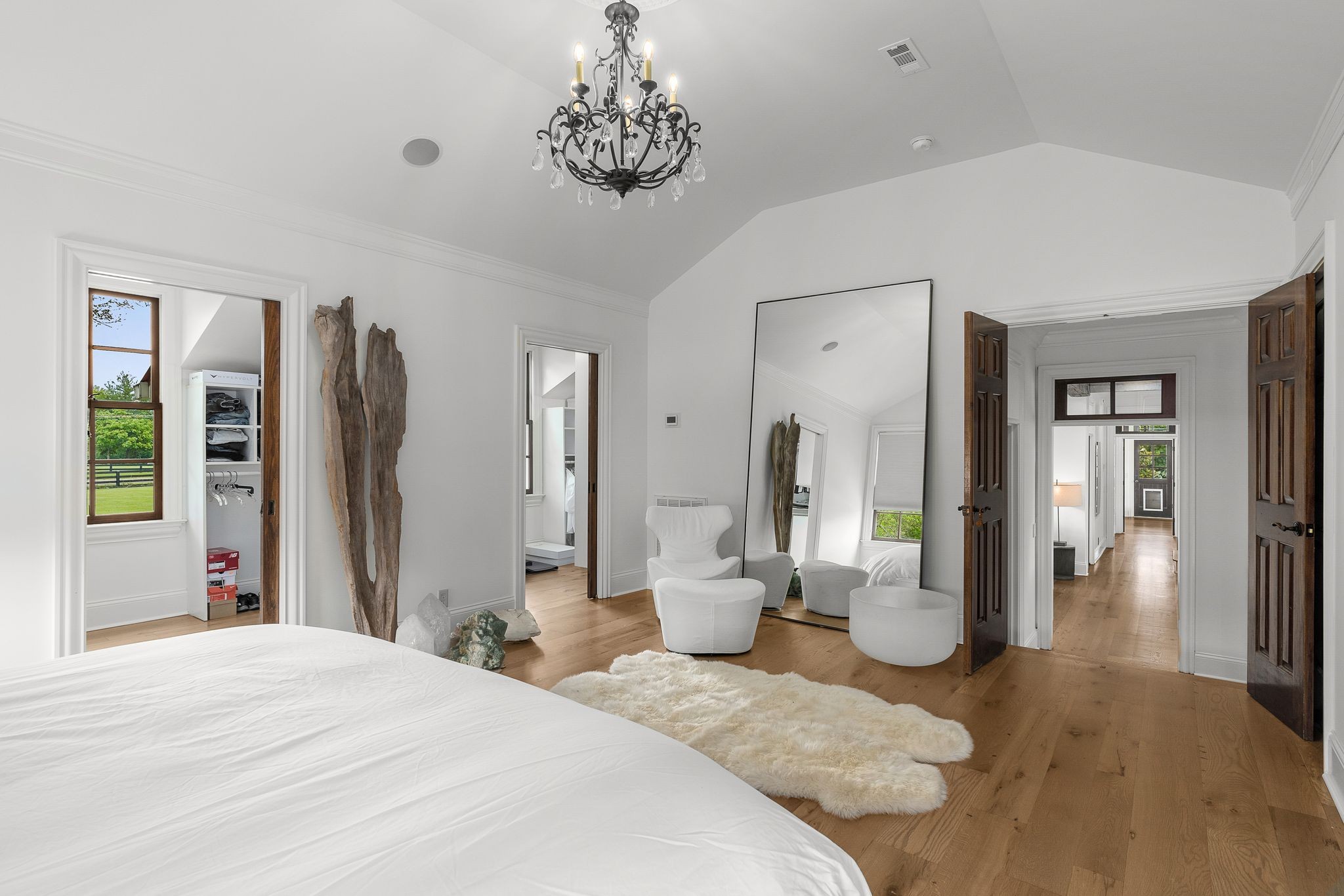 222 Arrowhead Road Franklin, TN 37069 - Photo 15 of 55 a bedroom with a bed and a chandelier