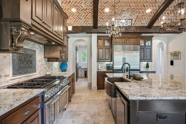 a dining room with furniture a chandelier and a rug