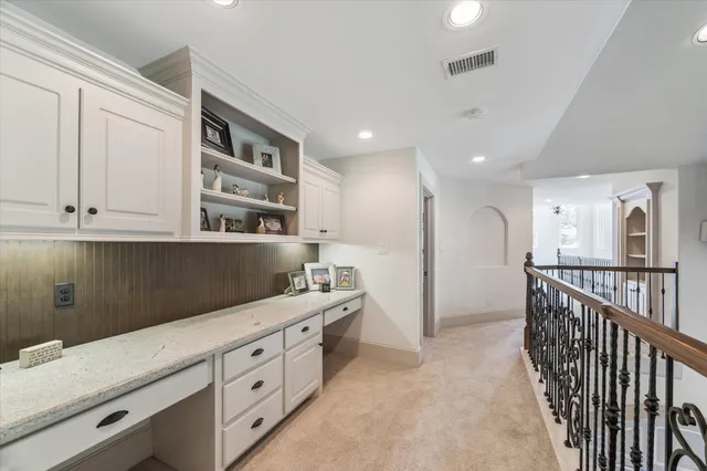 a bathroom with a granite countertop sink a mirror and vanity