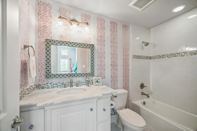 a view of a house with backyard and porch