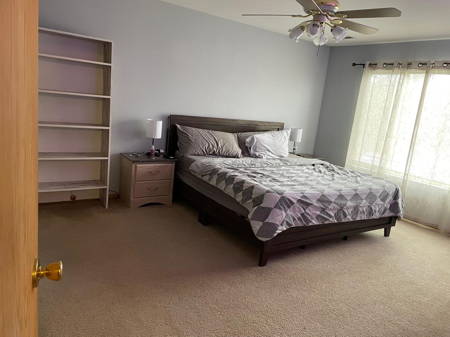 2497 Reflections Drive Aurora, IL 60502 - Photo 11 of 22 a bedroom with a bed and a window