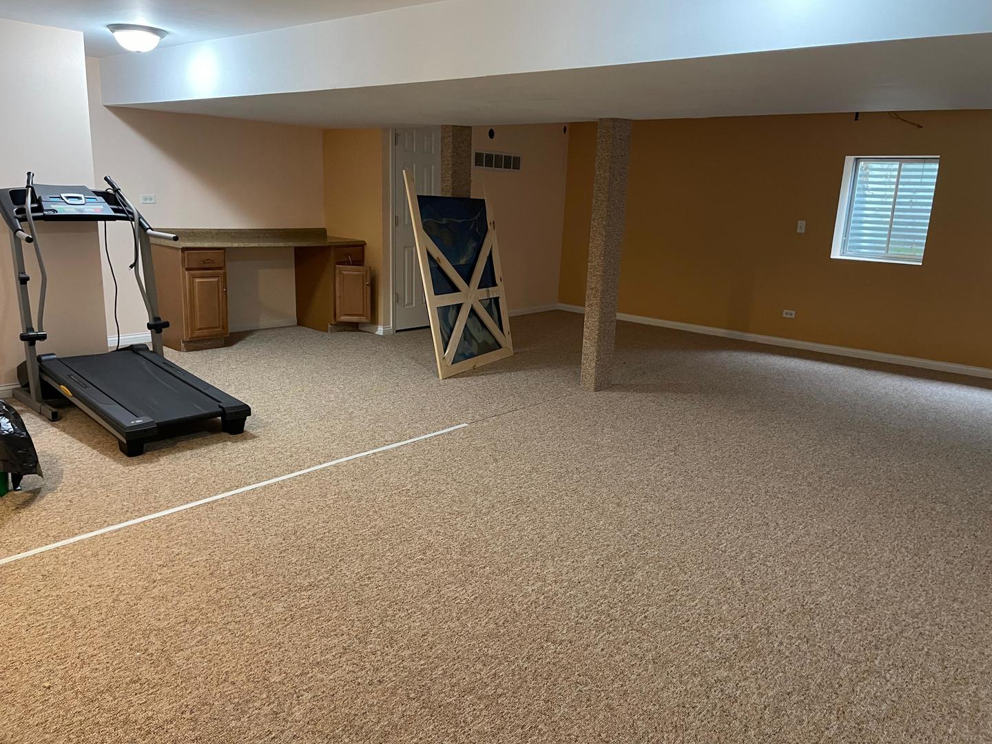 2497 Reflections Drive Aurora, IL 60502 - Photo 17 of 22 a room with gym equipment and a view of living room