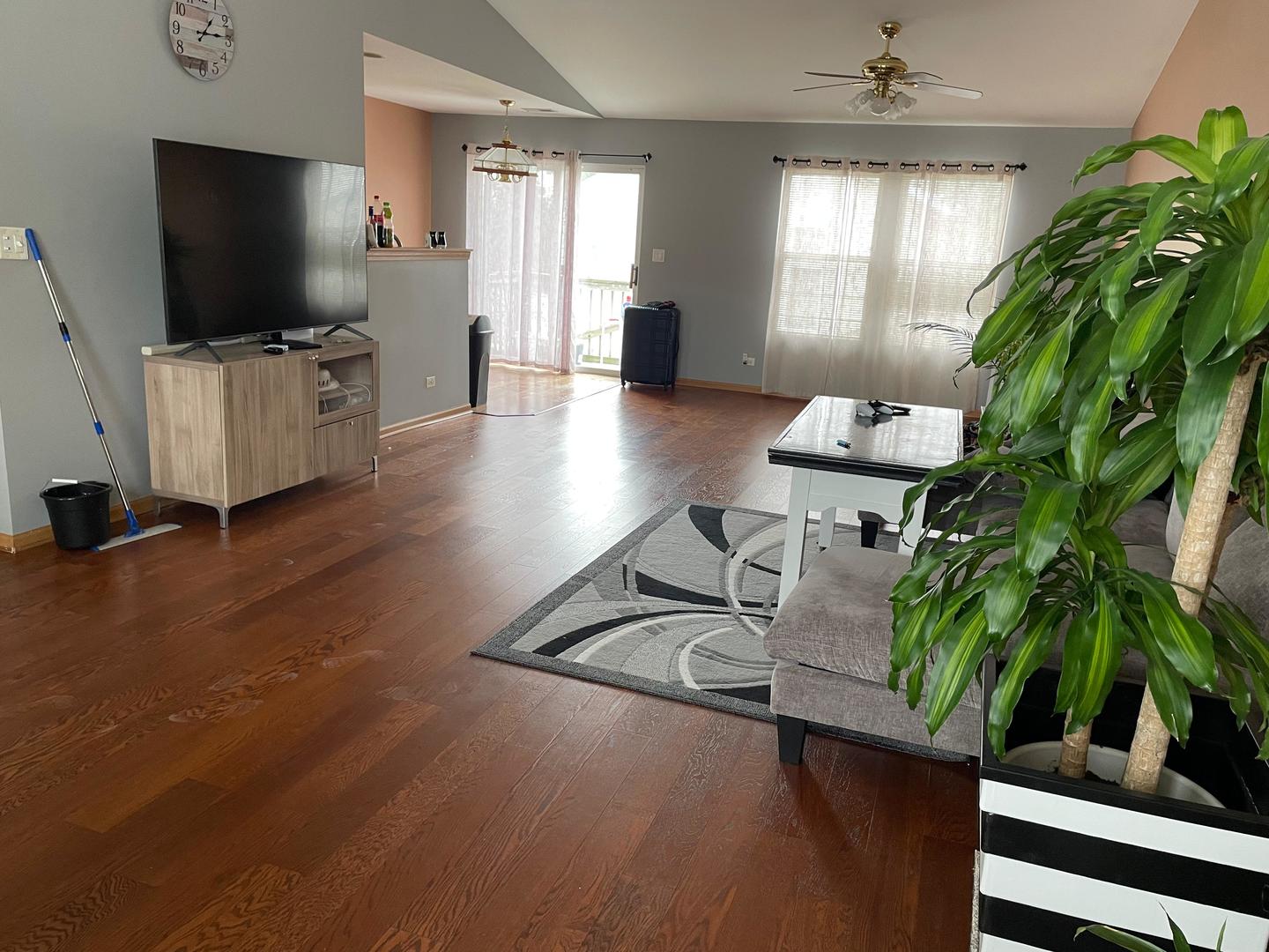 2497 Reflections Drive Aurora, IL 60502 - Photo 3 of 22 a living room with furniture and a flat screen tv