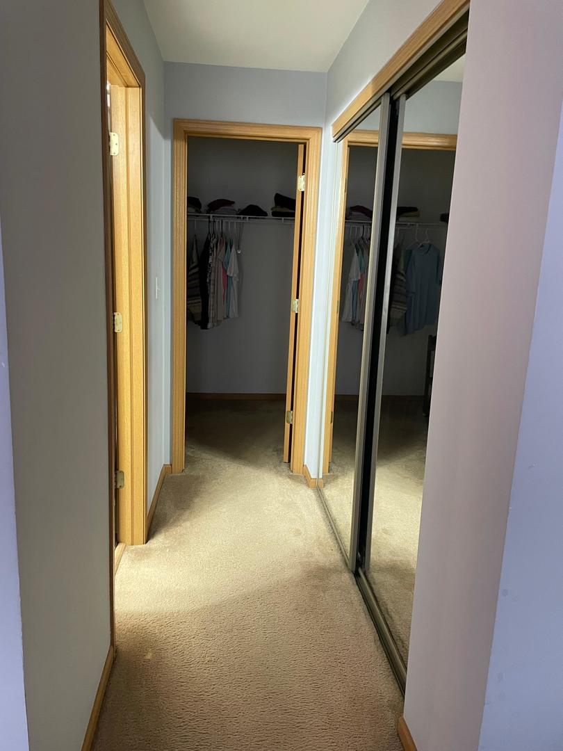 2497 Reflections Drive Aurora, IL 60502 - Photo 9 of 22 a view of a hallway with a glass door