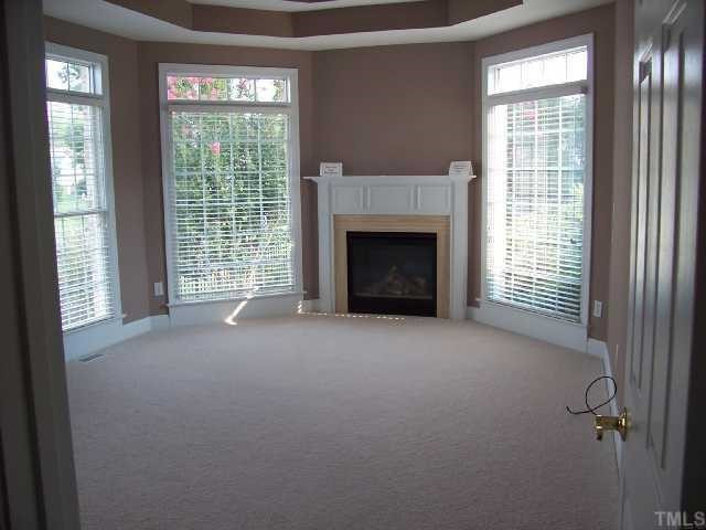 217 Challenge Road Raleigh, NC 27603 - Photo 6 of 12 Master Bedroom has gas log fireplace for cold winter evenings. Master Bedroom