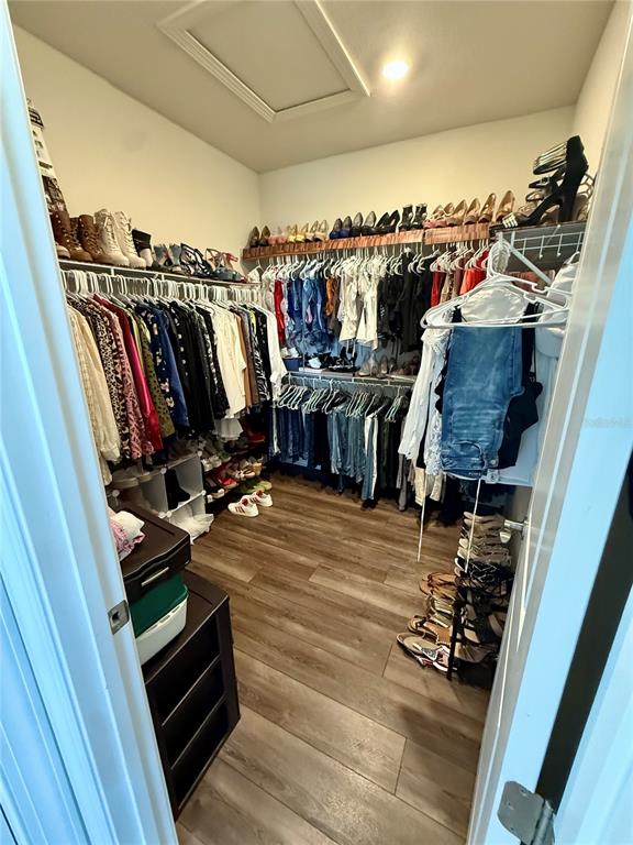8441 Pk Clf Way Orlando, FL 32836 - Photo 39 of 59 a view of walk in closet with clothes