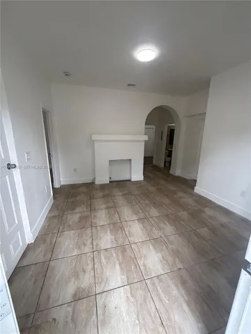 a view of an empty room and windows