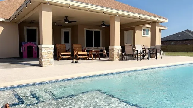 a view of a house with floor to ceiling windows