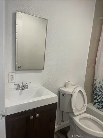 a bathroom with a toilet and a sink