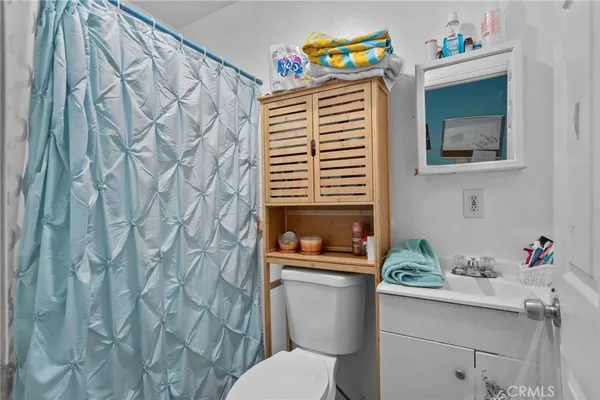 a bedroom with a bed and hallway