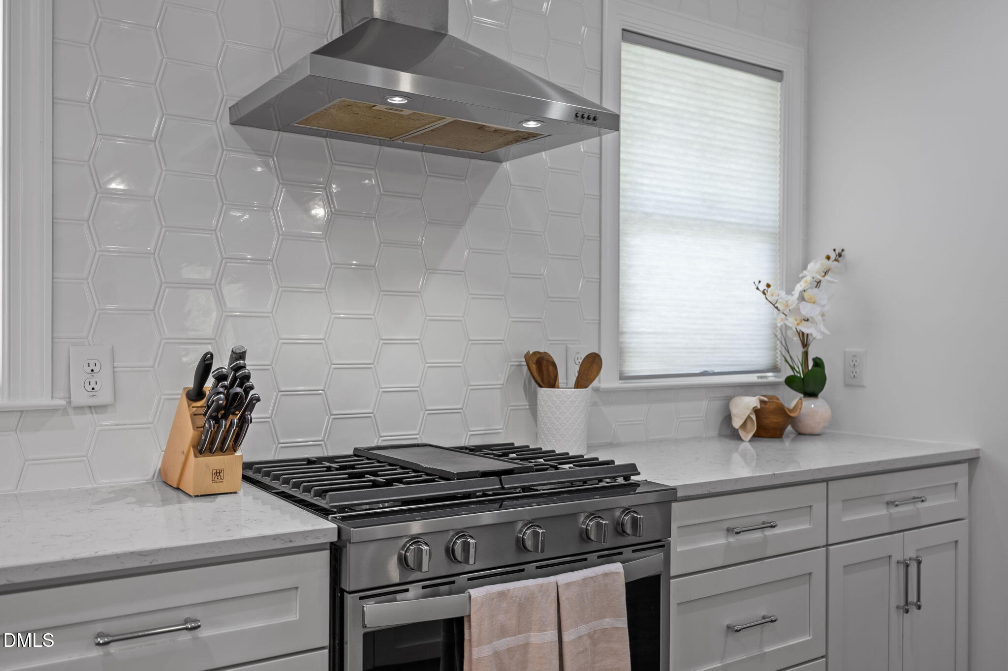 804 Hartford Road Raleigh, NC 27610 - Photo 5 of 26 a stove top oven sitting inside of a kitchen