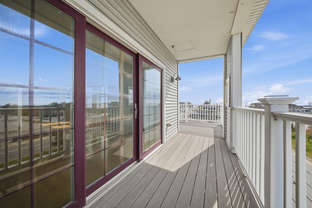 233 Beach Road, Unit A11 Salisbury, MA 01952 - Photo 28 of 37 a view of a balcony with wooden floor