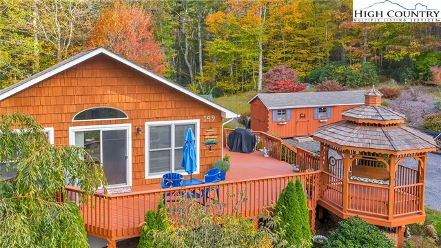 a view of a house with wooden fence