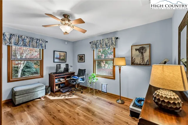 a view of a hallway with living room and furniture