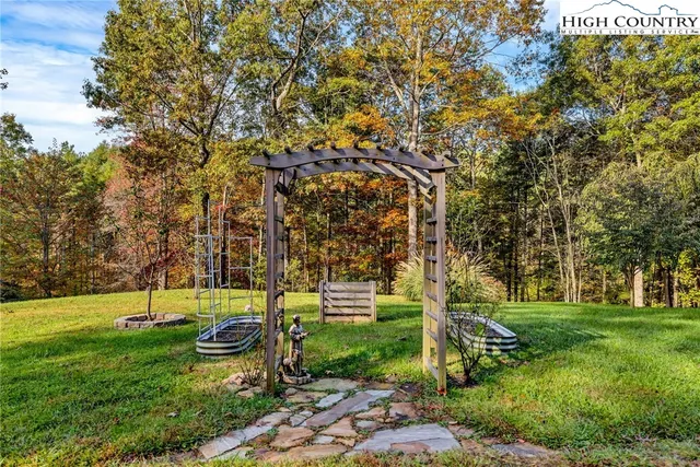 a view of a yard with swimming pool