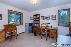 636 Bluebird Drive Bailey, CO 80421 - Photo 13 of 29 a view of a workspace with furniture and a window