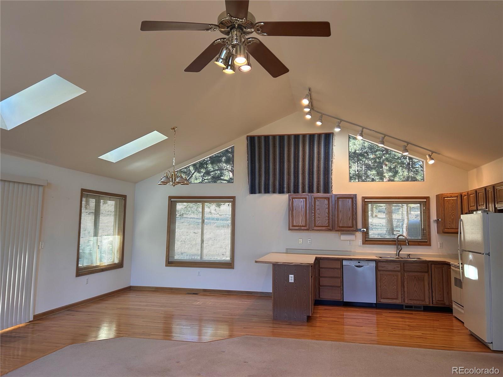636 Bluebird Drive Bailey, CO 80421 - Photo 22 of 29 a kitchen with stainless steel appliances kitchen island granite countertop a stove and a sink with cabinets