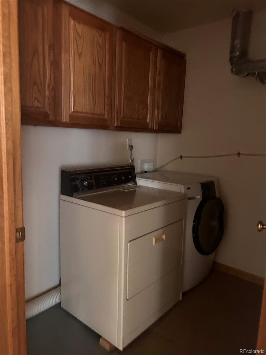 636 Bluebird Drive Bailey, CO 80421 - Photo 24 of 29 a utility room with dryer and washer
