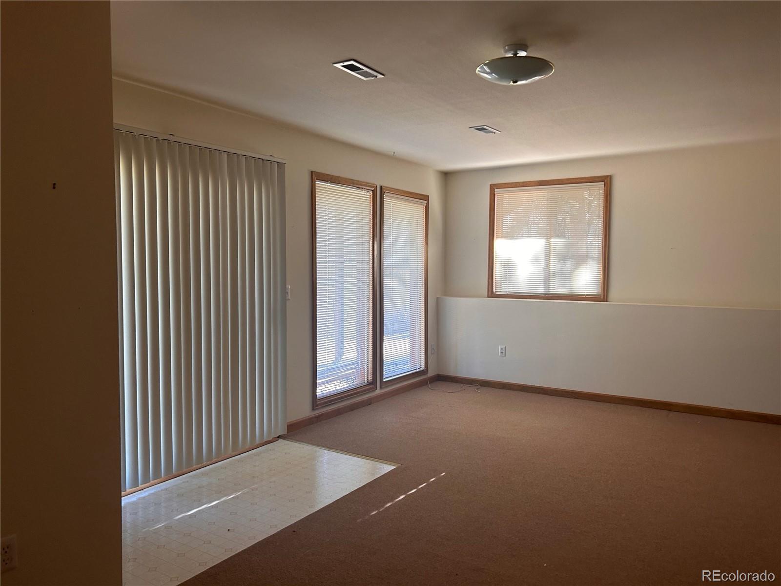 636 Bluebird Drive Bailey, CO 80421 - Photo 25 of 29 an empty room with windows