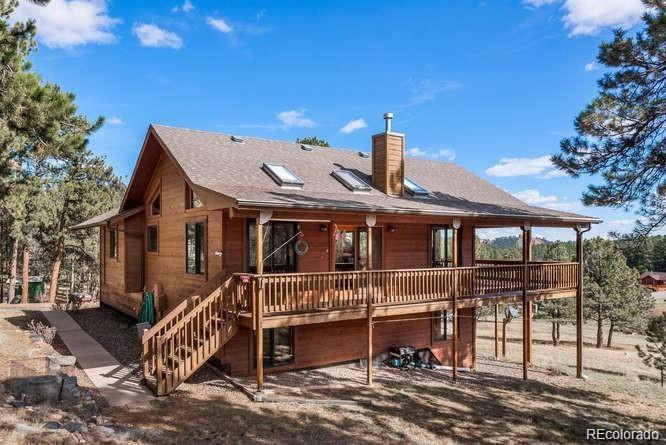 636 Bluebird Drive Bailey, CO 80421 - Photo 4 of 29 a front view of a house with a yard