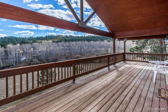 636 Bluebird Drive Bailey, CO 80421 - Photo 6 of 29 a view of balcony with wooden floor