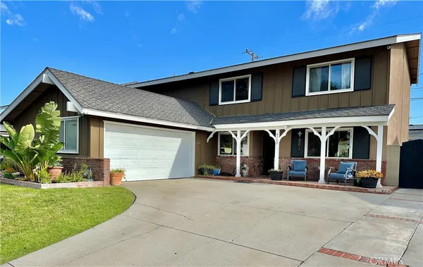 a front view of building with cars