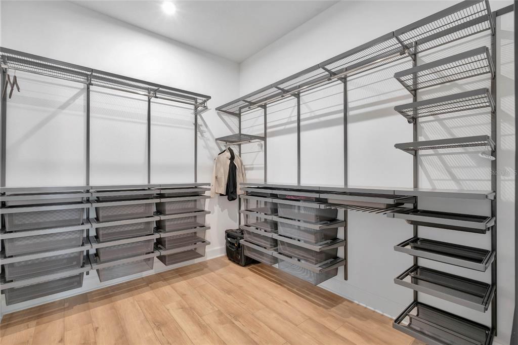 7540 Estuary Lake Loop Celebration, FL 34747 - Photo 14 of 35 a view of walk in closet with empty racks