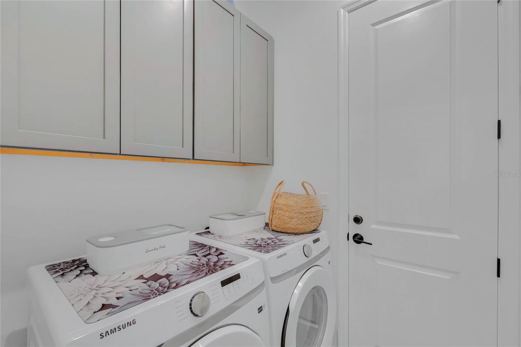 7540 Estuary Lake Loop Celebration, FL 34747 - Photo 15 of 35 a utility room with dryer and washer
