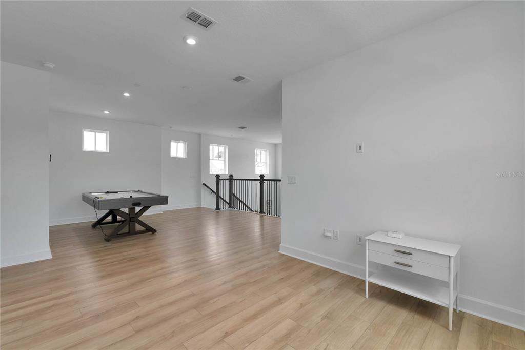 7540 Estuary Lake Loop Celebration, FL 34747 - Photo 21 of 35 a view of a living room and dining room