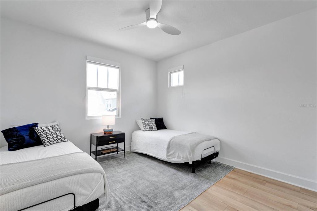 7540 Estuary Lake Loop Celebration, FL 34747 - Photo 25 of 35 a bedroom with a bed and a window