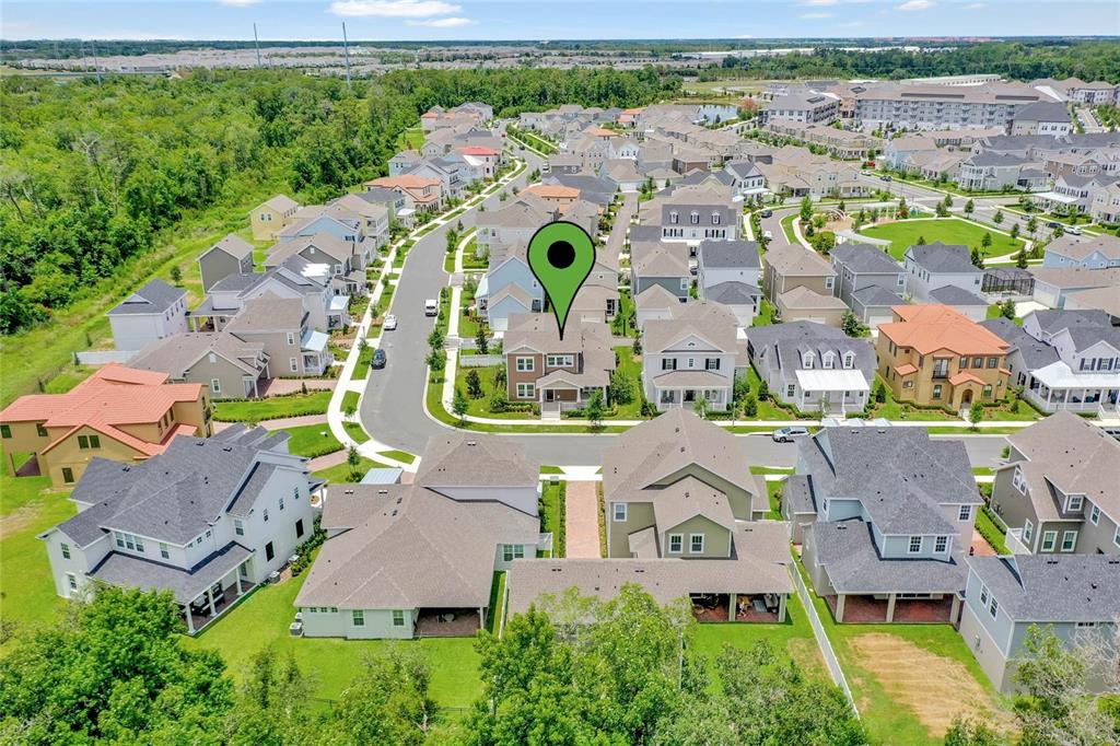 7540 Estuary Lake Loop Celebration, FL 34747 - Photo 31 of 35 an aerial view of residential houses with outdoor space and parking