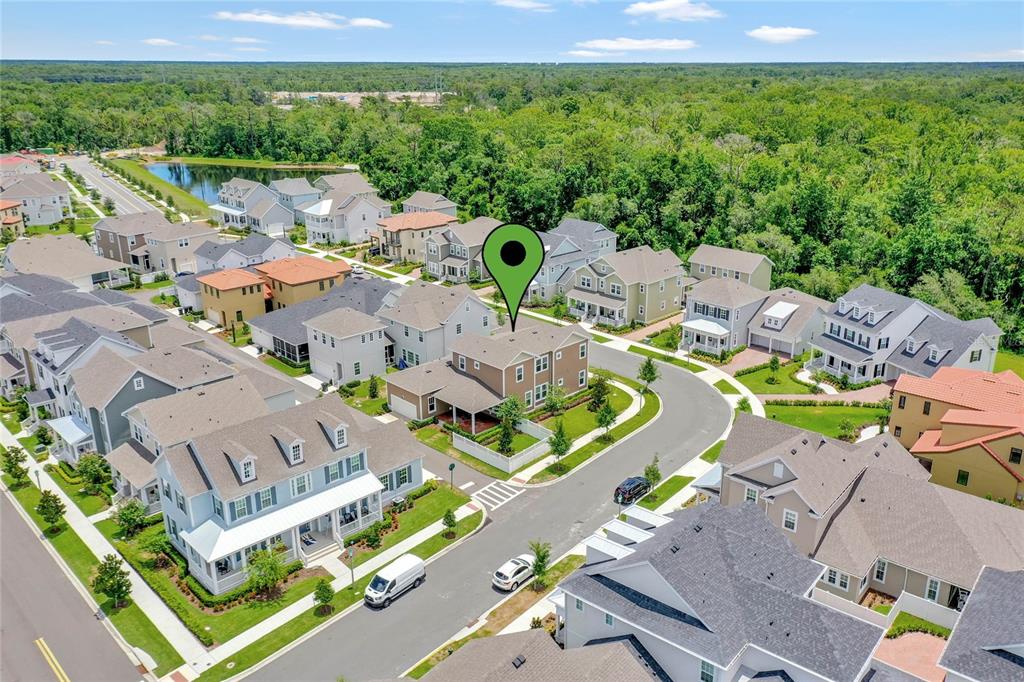 7540 Estuary Lake Loop Celebration, FL 34747 - Photo 32 of 35 an aerial view of residential house with outdoor space and swimming pool