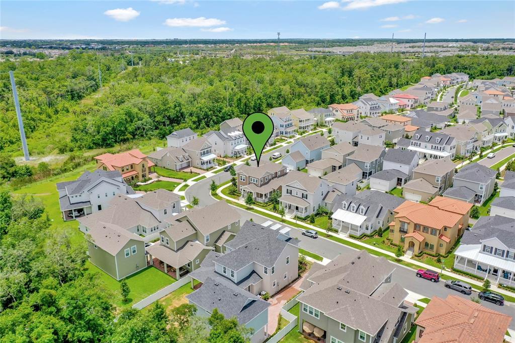7540 Estuary Lake Loop Celebration, FL 34747 - Photo 33 of 35 an aerial view of a house with garden space and street view