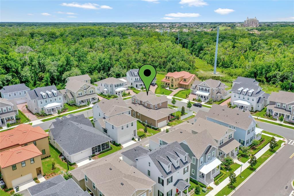 7540 Estuary Lake Loop Celebration, FL 34747 - Photo 34 of 35 an aerial view of multiple houses with yard