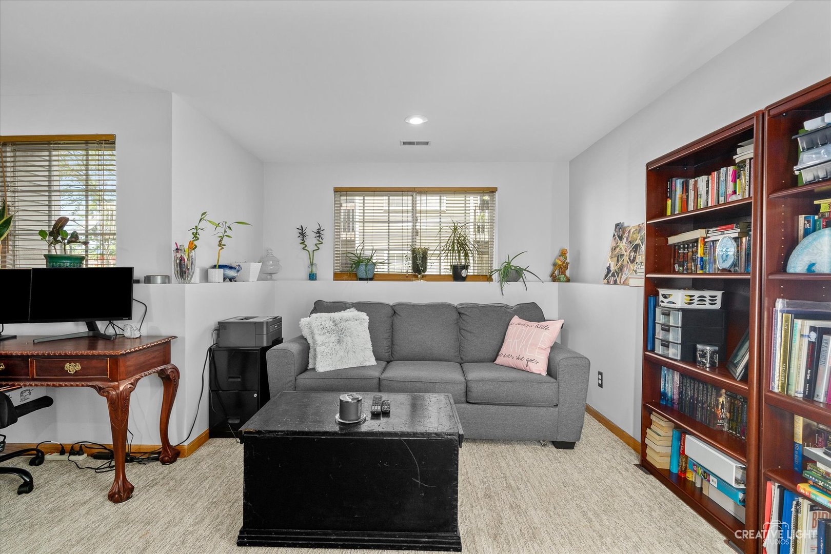662 South Peace Road Sycamore, IL 60178 - Photo 13 of 17 a living room with furniture a rug and a book shelf