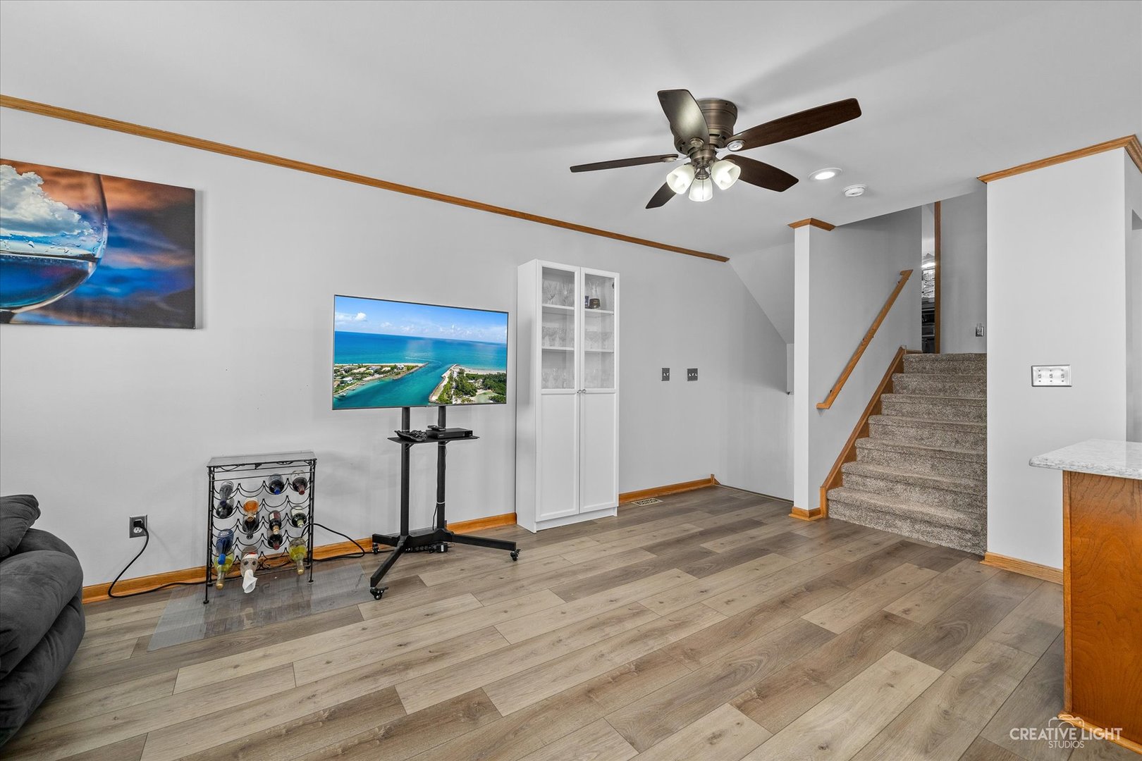 662 South Peace Road Sycamore, IL 60178 - Photo 4 of 17 a view of a livingroom with wooden floor and a ceiling fan