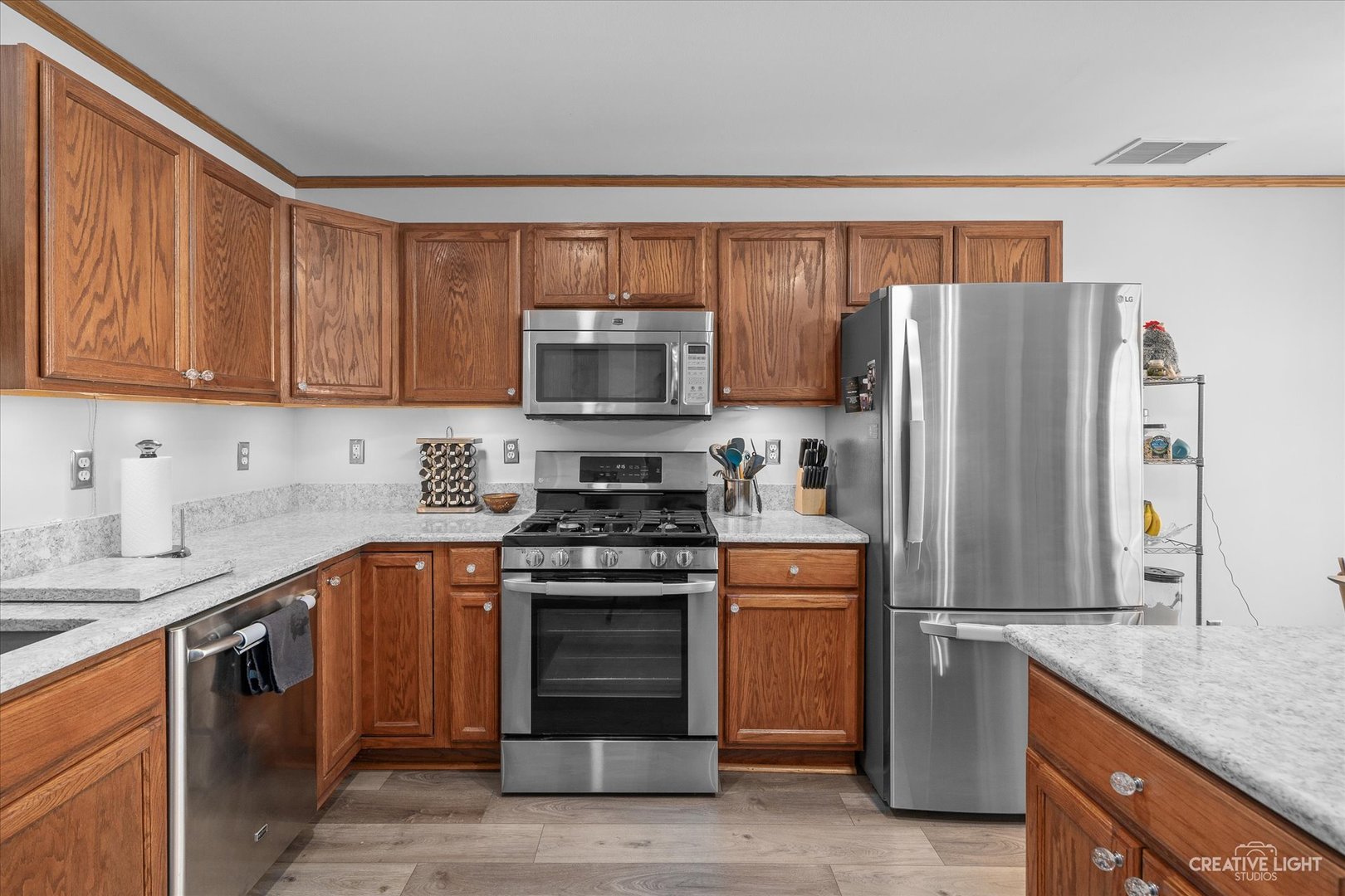 662 South Peace Road Sycamore, IL 60178 - Photo 7 of 17 a kitchen with stainless steel appliances granite countertop a refrigerator stove and sink