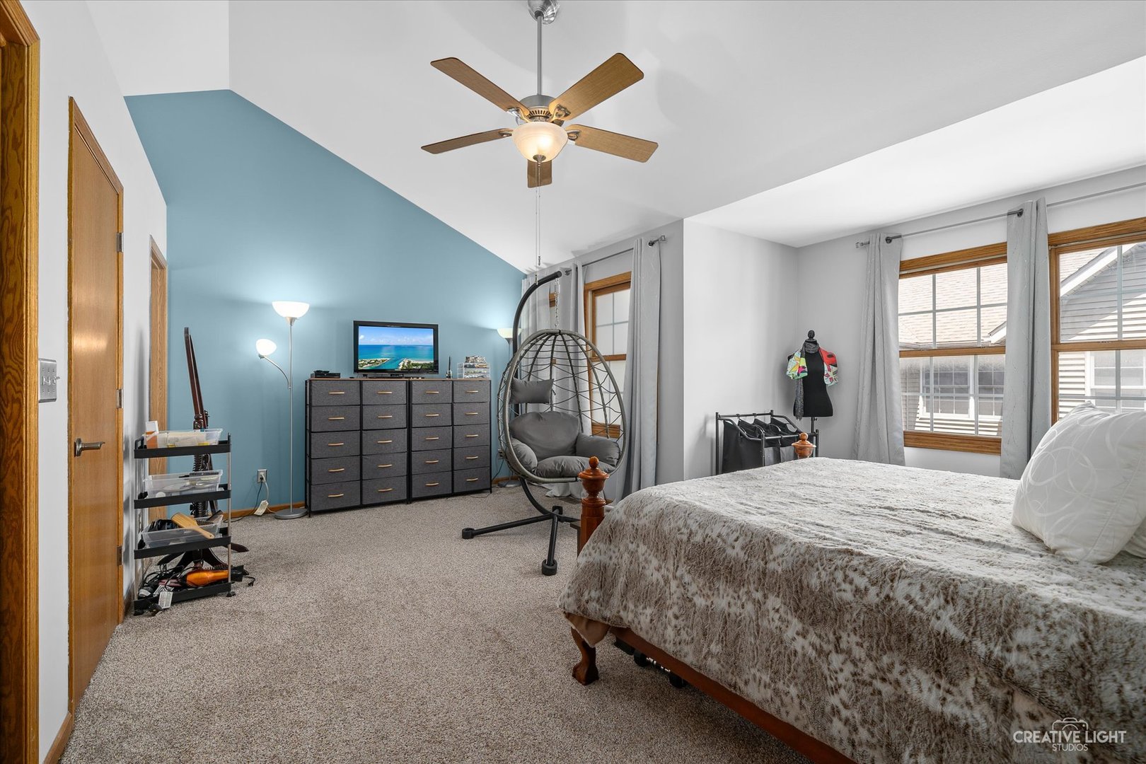 662 South Peace Road Sycamore, IL 60178 - Photo 10 of 17 a bedroom with a bed a large window and gym equipment