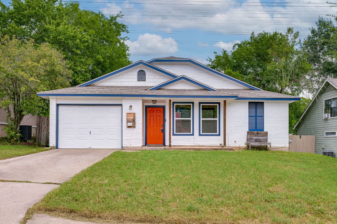 1416 Atterbury Lane Austin, TX 78754 - Photo 1 of 24 a front view of a house with a garden and porch