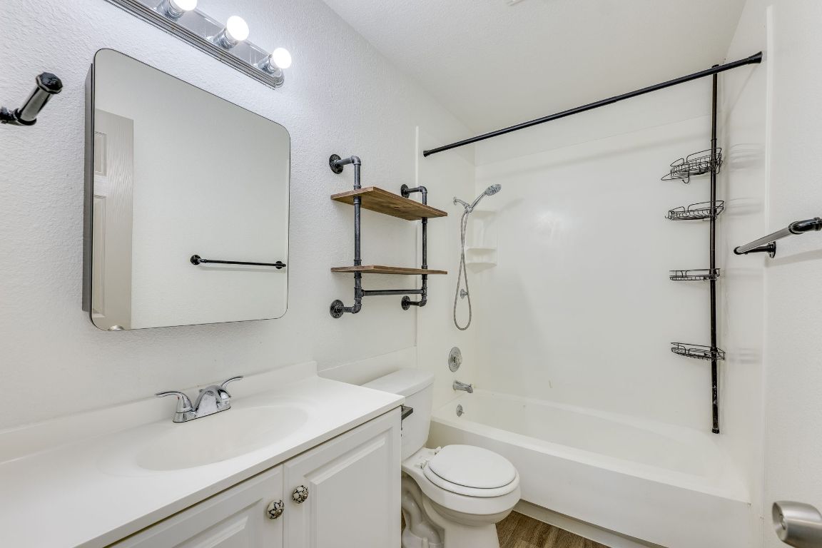 1416 Atterbury Lane Austin, TX 78754 - Photo 18 of 24 a bathroom with a sink toilet and shower