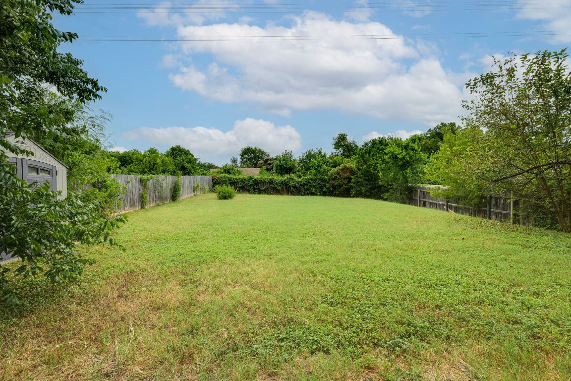 1416 Atterbury Lane Austin, TX 78754 - Photo 20 of 24 a view of a lake view with a garden