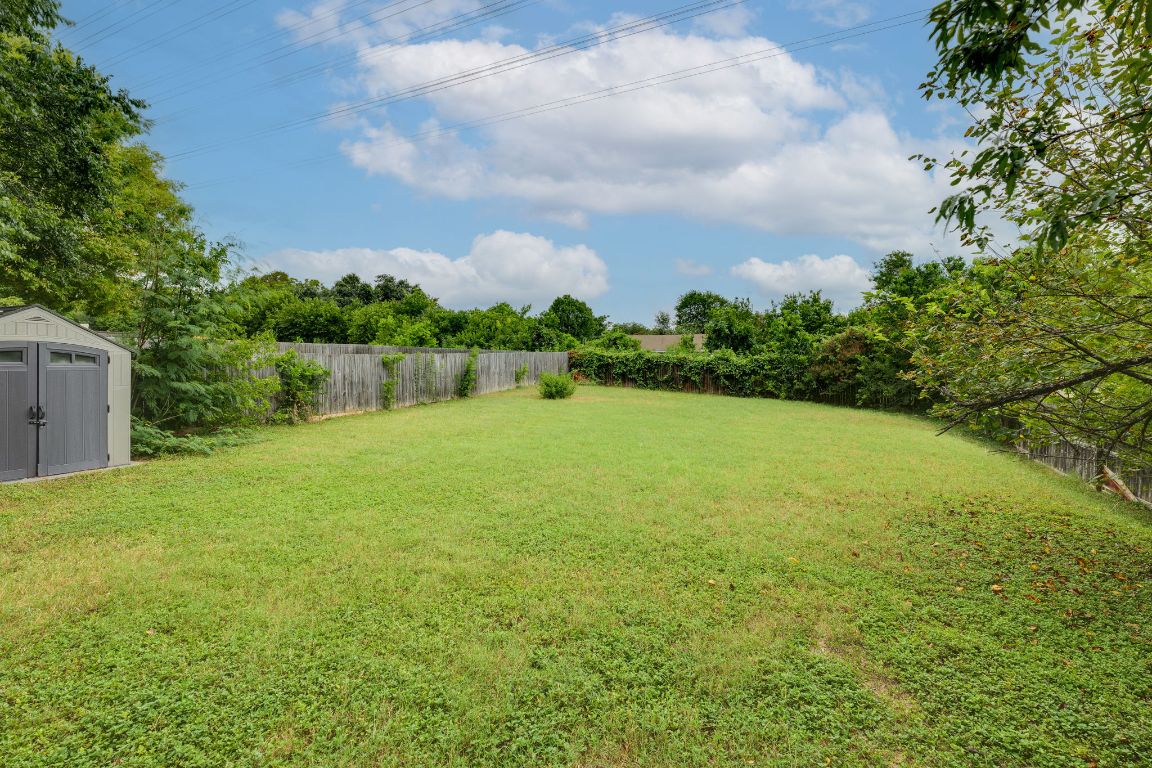 1416 Atterbury Lane Austin, TX 78754 - Photo 21 of 24 a view of a lake with a yard