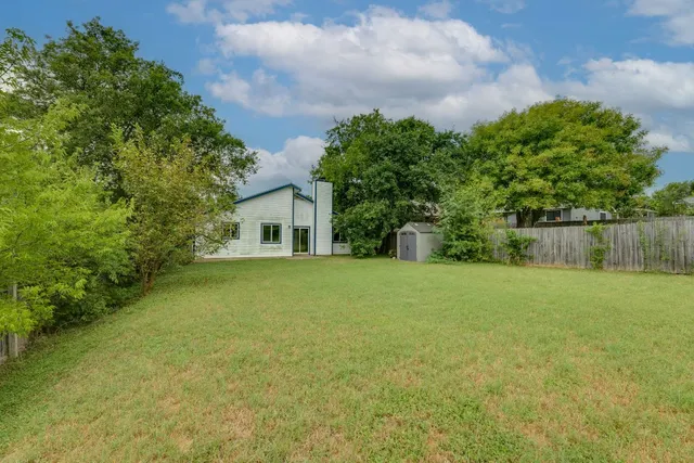 a house view with a garden space