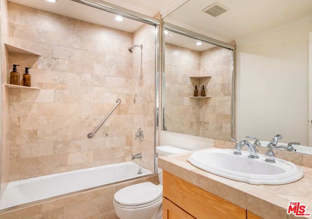 1131 Alta Loma Road, Unit 116 West Hollywood, CA 90069 - Photo 11 of 25 a bathroom with a sink a toilet and a bathtub