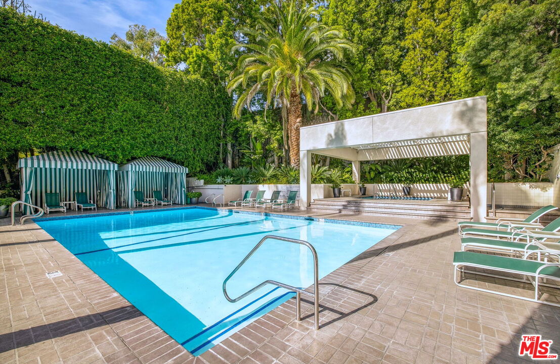 1131 Alta Loma Road, Unit 116 West Hollywood, CA 90069 - Photo 13 of 25 a view of a swimming pool with a patio