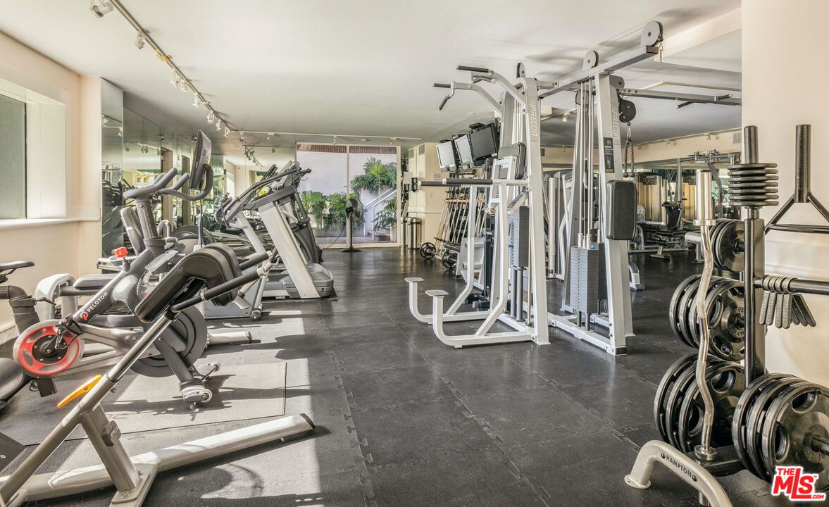 1131 Alta Loma Road, Unit 116 West Hollywood, CA 90069 - Photo 18 of 25 a view of a room with gym equipment