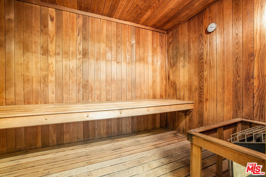1131 Alta Loma Road, Unit 116 West Hollywood, CA 90069 - Photo 19 of 25 a bathroom with a sink and shower curtain