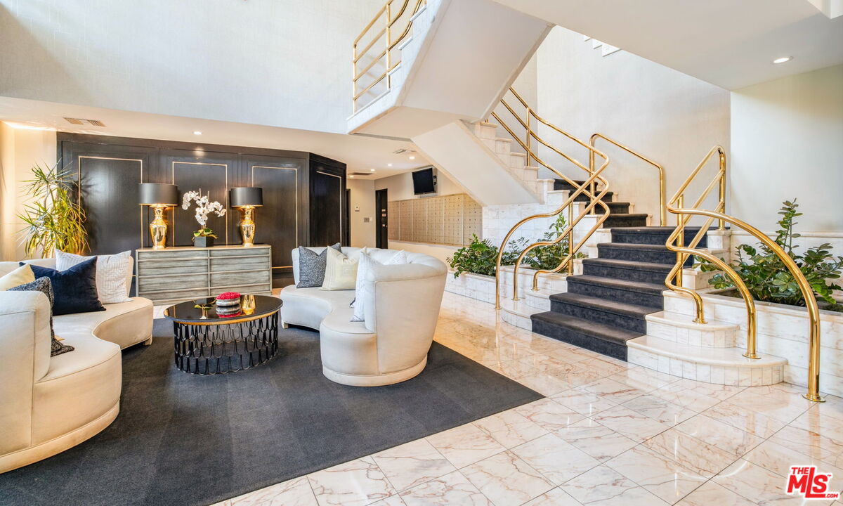 1131 Alta Loma Road, Unit 116 West Hollywood, CA 90069 - Photo 21 of 25 a living room with furniture and wooden floor